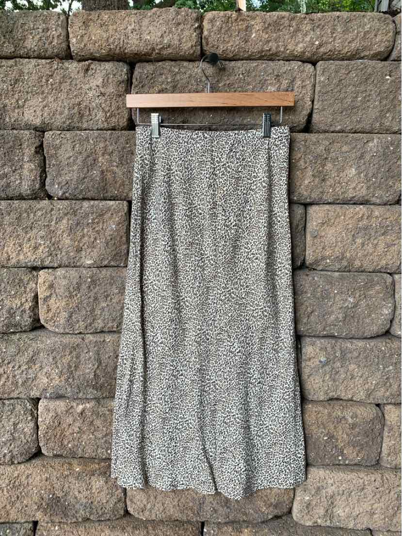 Tan cheetah print midi skirt with slight flare and elastic waistband, size XS.