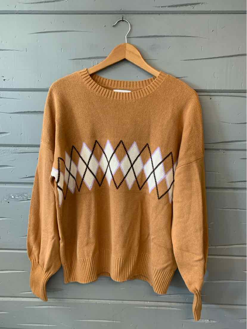 Camel-colored knit sweater with white and brown argyle pattern across the chest, crew neck, long sleeves, and relaxed fit.