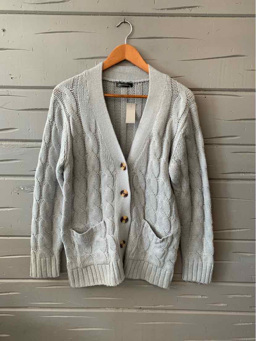 Light blue cable knit cardigan with buttons and two front pockets, size small.