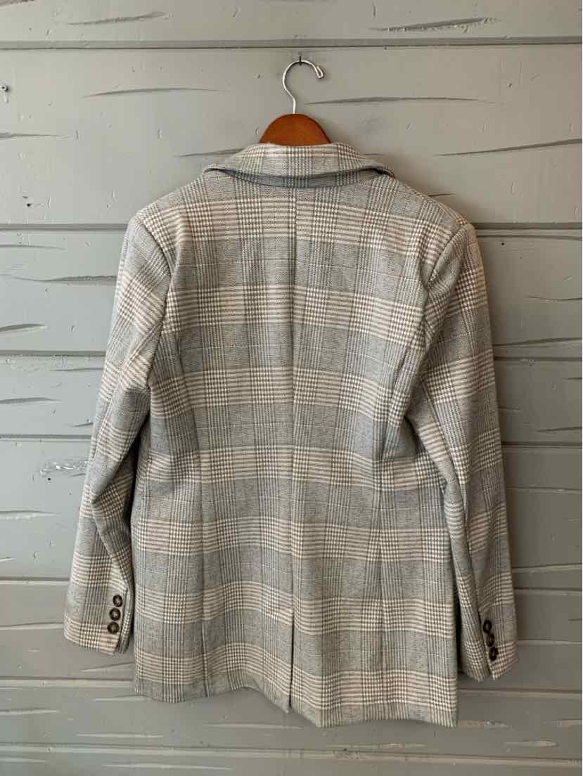 Gray plaid women’s jacket with a tailored shape, notched collar, and buttoned cuffs, shown from the back.