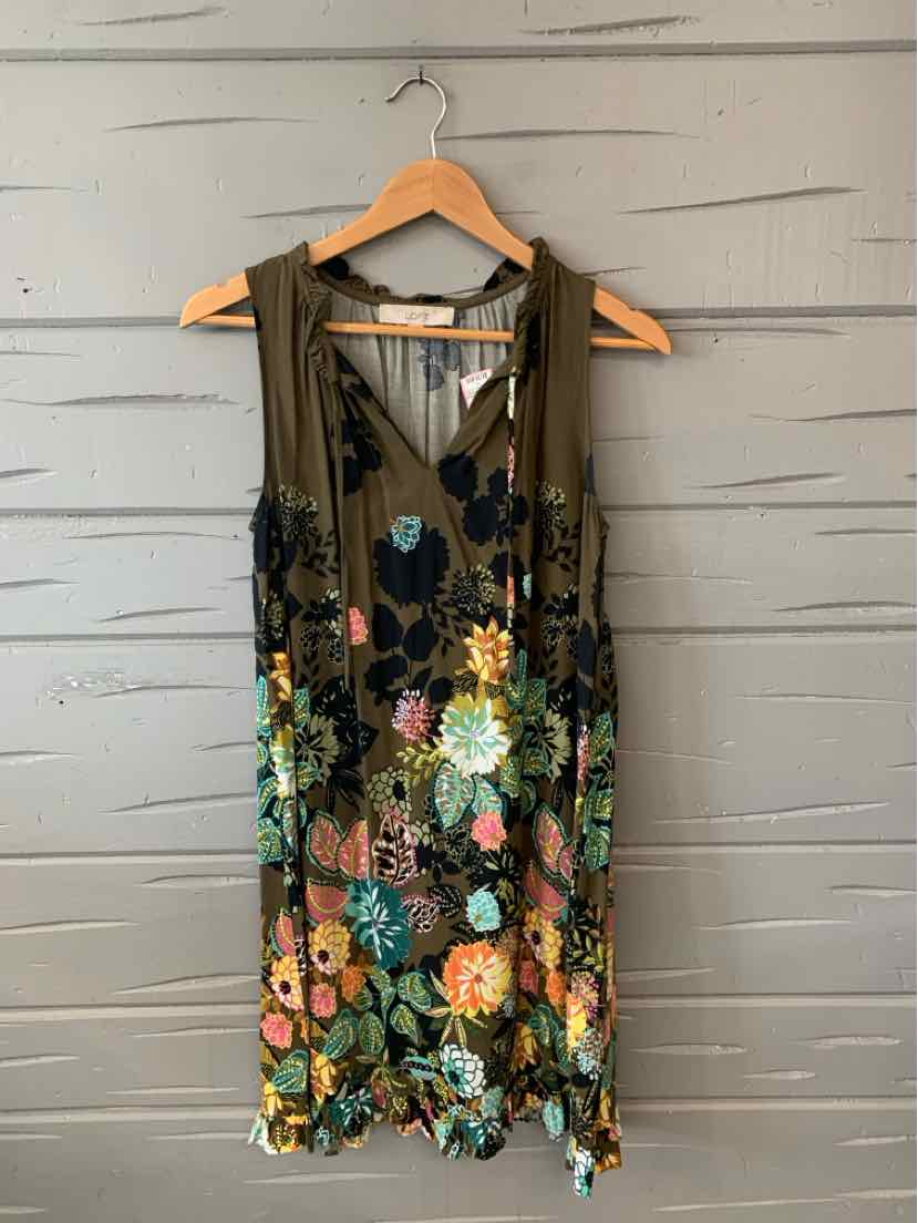 Sleeveless olive green dress with colorful floral embroidery and V-neck on wooden hanger.