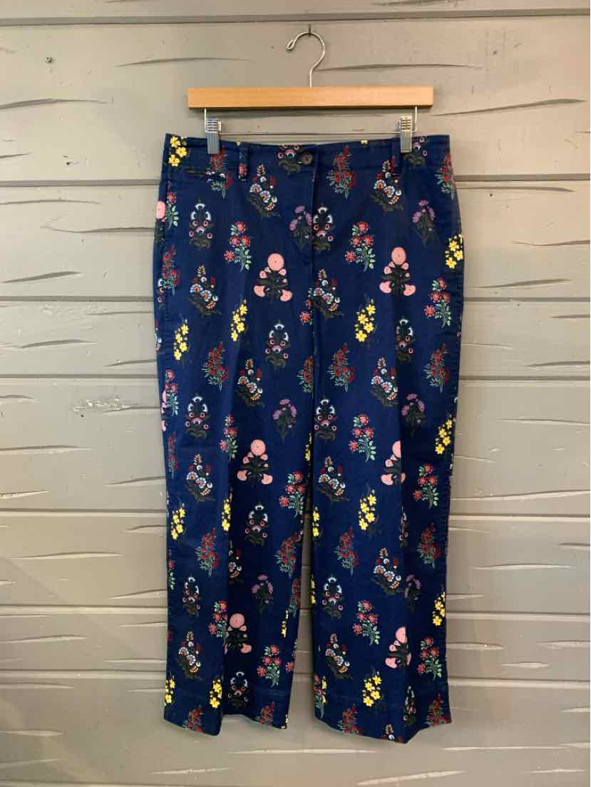 Navy blue cropped pants with colorful floral print and straight-leg cut.
