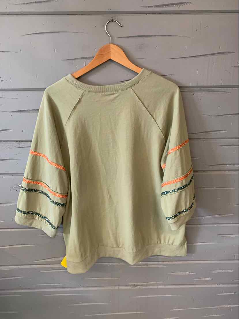 Light olive green long-sleeve shirt with puffed sleeves, featuring orange and black stripe details on sleeves and a crew.