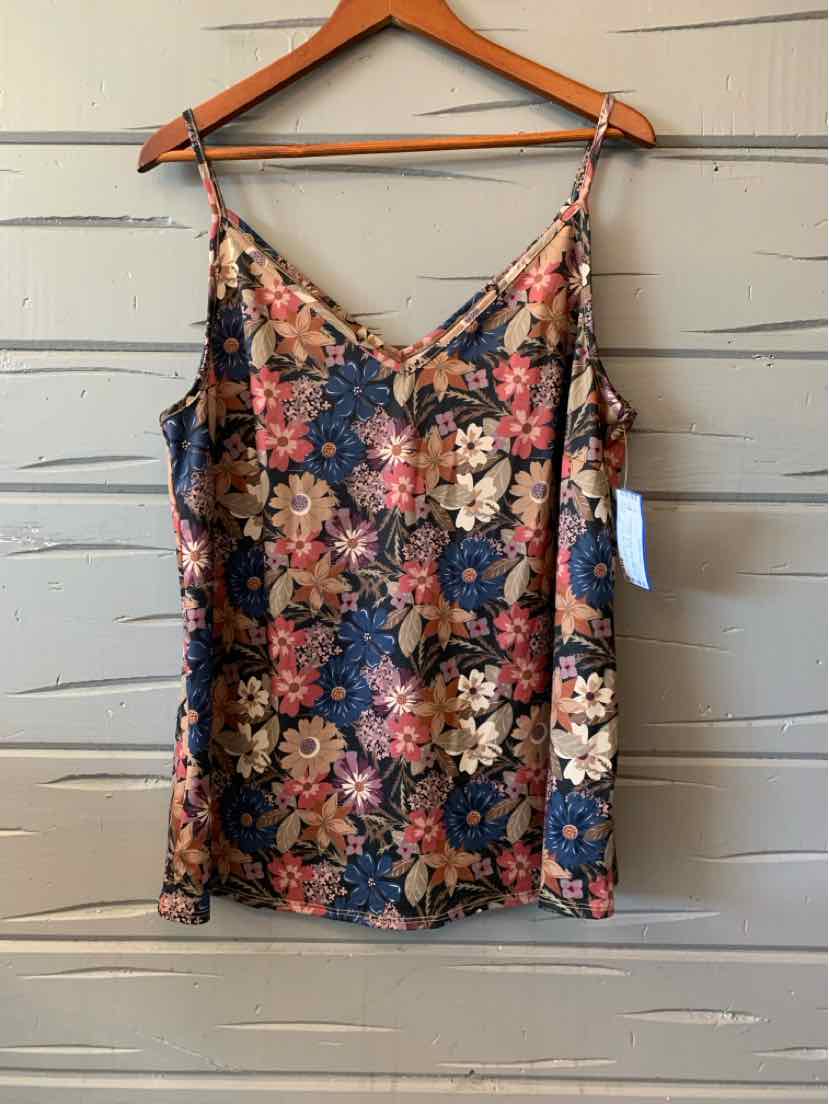 Floral print women's casual top with thin straps in multi-color hanging on wooden hanger.