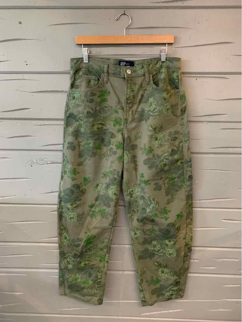 Green floral patterned casual pants with a relaxed fit and button closure at the waist.